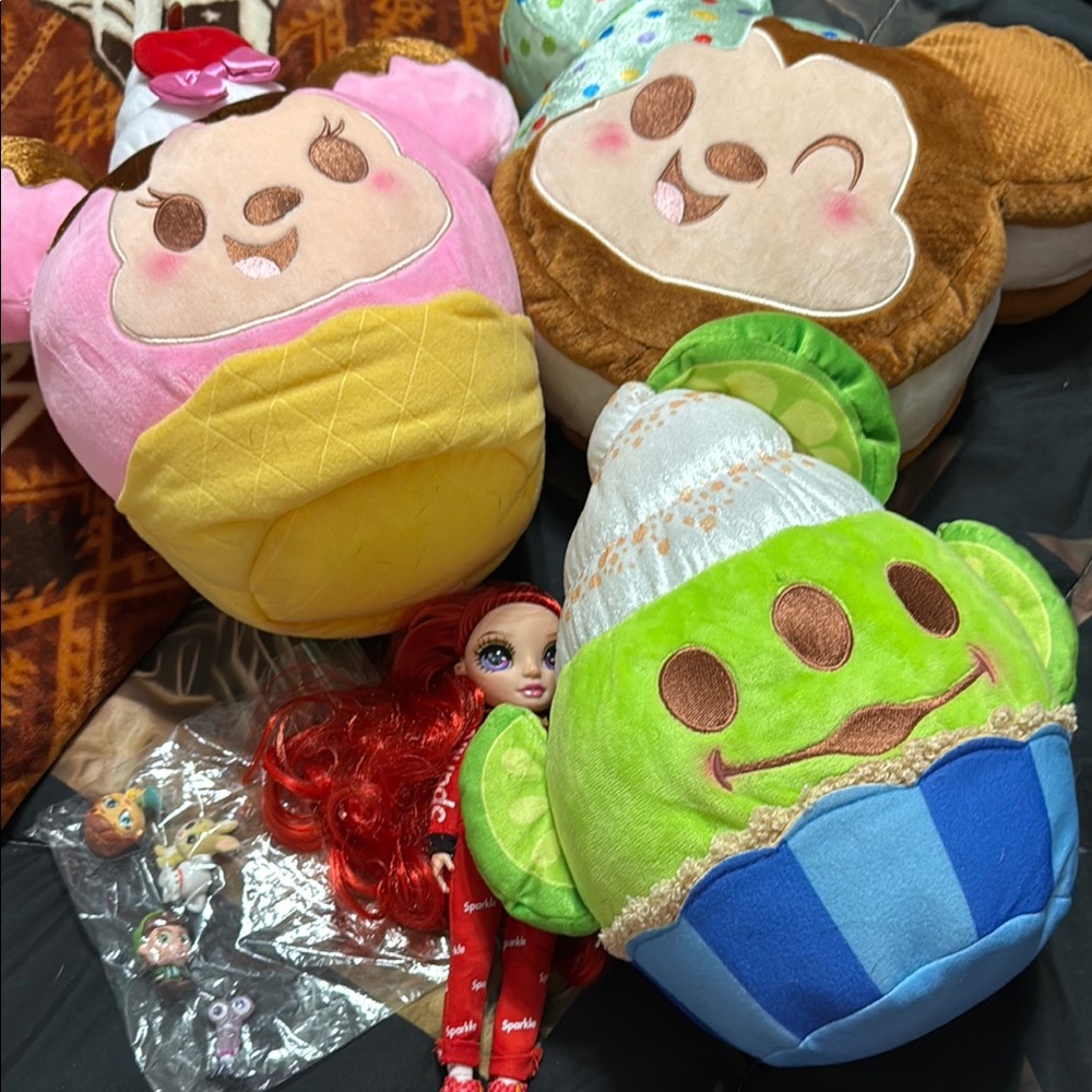 Disney plush doorables and a rainbow high doll